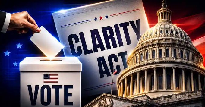 The image features a political campaign poster with an American flag and a white box labeled "vote" with a ballot inside. A hand is seen putting a piece of paper into a voting machine, symbolizing the act of casting a vote for clarity on the CLARITY Act. The text in the image reads "CLARITY Act Tomorrow A session to discuss and amend the provisions of the CLARITY Act is scheduled for tomorrow, June 5, at exactly 10:30 AM Eastern Time (EST). The wheel of cryptocurrency legislation is turning quickly in Washington, so XRP holders should follow the".