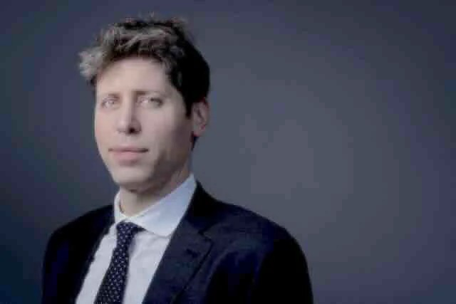 The image shows a man in a dark suit with a dotted tie against a gray background, looking directly at the camera with a subtle, self-satisfied expression.

The post's joking tone ("0 bitches," burning money on tokens) pairs ironically with the polished, corporate-headshot aesthetic of the image—evoking a tech executive parody where the confident, suit-clad pose mocks a startup founder who has launched zero products and generated zero revenue.