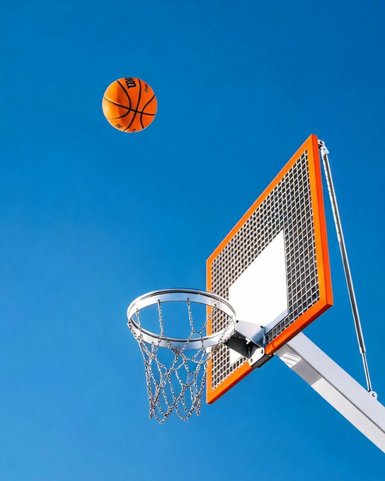 The image features an orange basketball flying through the air, heading towards a basketball hoop with a white net. The scene takes place against a blue sky background, creating a visually appealing contrast between the vibrant colors of the ball and the clear sky. The caption "Every shot is a market move. #Bybit NewFinancialPlatform" suggests that this image could be related to a sports-related business or event, possibly an advertisement for a basketball game or tournament.

The main focus of the image is on the basketball hoop with the orange ball in mid-air, emphasizing its importance and capturing the viewer's attention. The blue sky serves as a beautiful backdrop that highlights the dynamic nature of the sport and adds to the overall visual appeal of the scene.