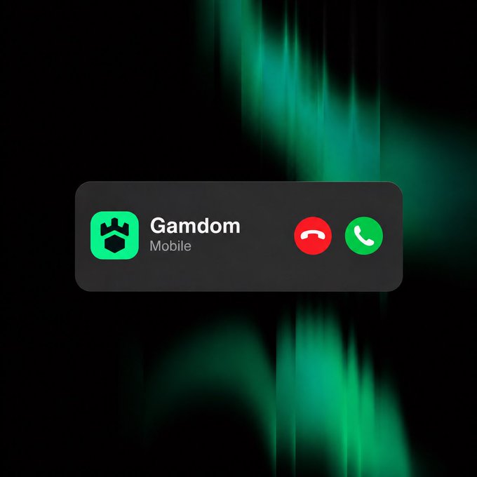 A smartphone notification reading "Gamdom Mobile" appears on a black screen with green abstract lighting, accompanied by red decline and green accept call buttons. The image visually represents the "Gamdom is calling" message, mimicking an incoming phone call interface from the Gamdom mobile app.