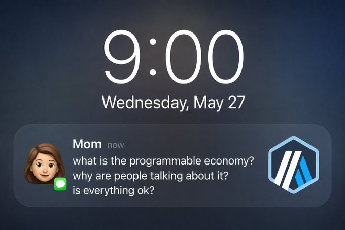 The image shows a message from an app icon, which reads "Everything's fine mom. We're just powering the programmable economy." The message is displayed on a phone screen with a clock showing 9:00.