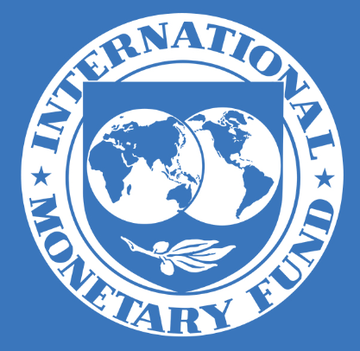 The image shows the official blue and white logo of the International Monetary Fund (IMF), featuring two globes and an olive branch encircled by the organization's name. The logo relates to the post as it represents the IMF, the institution that conducted El Salvador's $1.4 billion EFF review and made statements about the country's bitcoin accumulation and Chivo e-wallet.