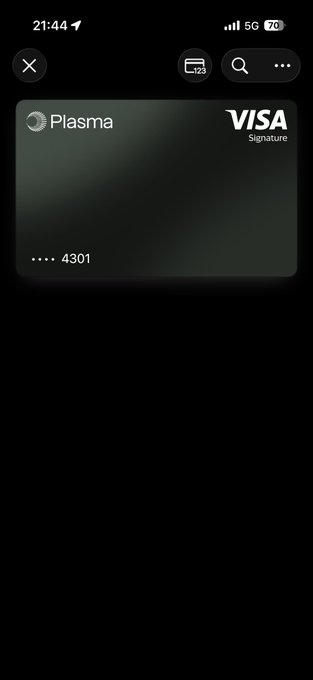 The image shows a smartphone screen displaying a Visa credit card reader app, which is open and ready for use. The app allows users to scan their Visa credit cards using the phone's camera or an external scanner. The app also provides information about the card, such as its expiration date and the amount of money on it. The background of the image is black, making the white text on the screen stand out clearly.