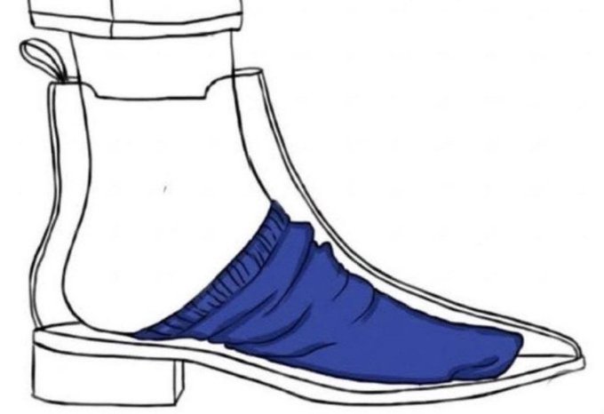 The image shows a black and white line drawing of a person's foot with a blue sock inside, placed over the heel area of the shoe. The drawing also includes a description that reads "How it feels to hold Ethereum since 2025". This suggests that the image is related to the world of cryptocurrency or blockchain technology, possibly discussing the experience of wearing a smart coin wallet on one's foot and how it might feel like holding a digital asset in the form of Ether.