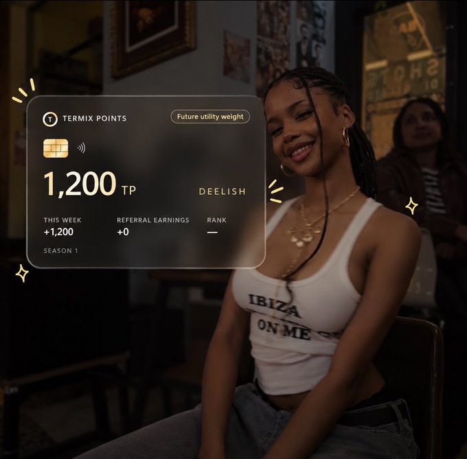 A smiling young woman wearing a white tank top that reads "IBIZA ON ME" sits indoors, with a digital overlay showing a "TERMIX POINTS" card displaying "1,200 TP", "THIS WEEK +1,200", and the username "DEELISH".