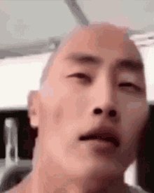 The image features a man with a shaved head, looking up at something or someone above his head. He appears to be making eye contact with the viewer, possibly posing for a photo. The caption of the image reads "Send it Higher please I can still see", which suggests that the person taking the picture might have been too focused on capturing the moment and missed some important details in the scene.