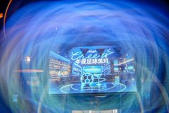 A dynamic, blue-toned promotional graphic for Bitget's "Midnight Soccer Party" featuring the company's logo and stylized football/soccer iconography, visually echoing the lively watch-party atmosphere described in the post.