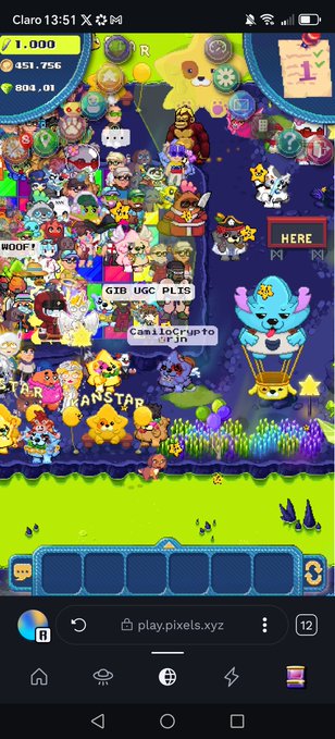 A screenshot of the Pixels.xyz game on a Claro 13:51 mobile device, showing a crowded pixel-art world with 'GIB UGC PLUS,' 'CamiloCripto - OF IN,' 'HERE,' 'WOOF!,' 'STAR,' and 'KANSTAR' text amid many characters.