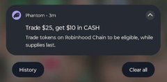 A notification from Phantom wallet stating 'Trade $25, get $10 in CASH' about a promotion for trading tokens on Robinhood Chain, with options to view History or Clear all.