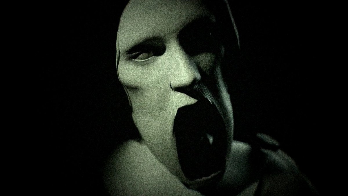 A dark, greenish-toned close-up of a person's face with wide eyes and a wide-open mouth in an expression of shock or screaming.