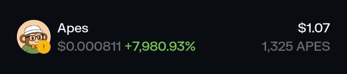 The image shows a cryptocurrency portfolio entry for the meme coin "Apes" trading at $1.07, up 7,980.93% from $0.000811, with a holding of 1,325 APES tokens. This visually confirms the post's claim of turning $0.22 into $1.07—a 4.86x return—while highlighting the extreme volatility typical of meme coin investments.