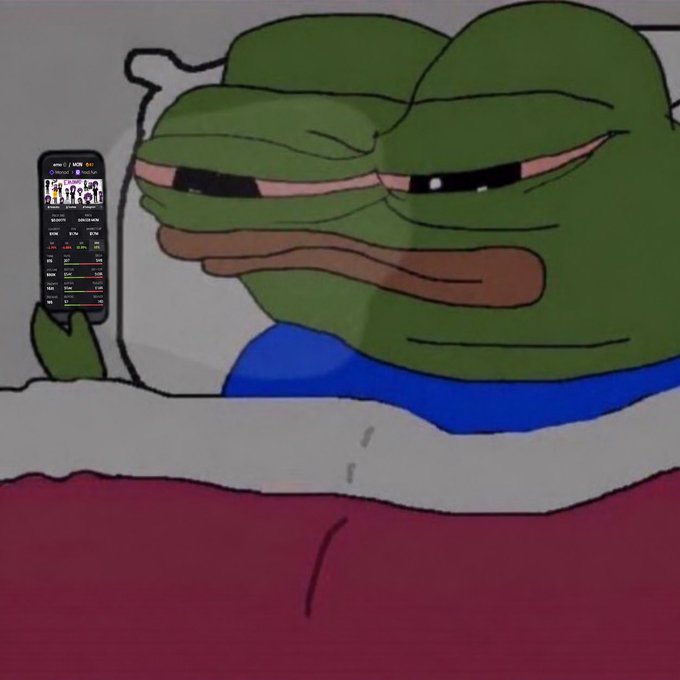 The cartoon character Pepe the Frog lies in bed under a red blanket, looking tiredly at a smartphone displaying what appears to be a stock or crypto trading app with colorful charts and numbers.