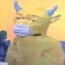 A low-resolution image of a cow wearing a face mask.