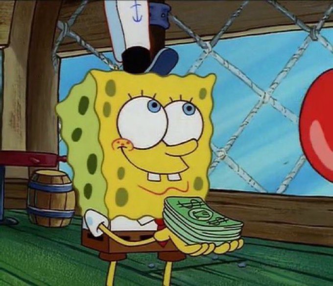 SpongeBob SquarePants happily holds a stack of cash, his cheeks blushing with excitement, while wearing a small sailor's hat. The image humorously illustrates the post's joke about prioritizing spending on memecoins over groceries, with SpongeBob's joyful expression perfectly capturing the irrational enthusiasm of making such a financial choice.