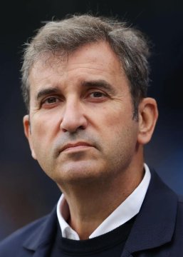 The image shows a middle-aged man with graying hair wearing a dark suit and white shirt, appearing serious and contemplative. Given the context about Manchester City's CEO making controversial statements regarding the club's guilty verdicts, the man pictured is likely Ferran Soriano, CEO of Manchester City Football Club.
