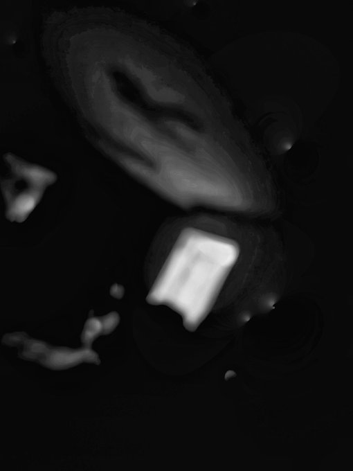 A dark, blurry black-and-white image with abstract glowing shapes and streaks against a black background.