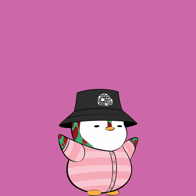 A cartoon penguin character wearing a black bucket hat with a "PUG LIFE" skull-and-crossbones logo, a pink striped shirt, and a watermelon-patterned bandana stands against a solid pink background, fitting the playful "Pengu" theme of the post.