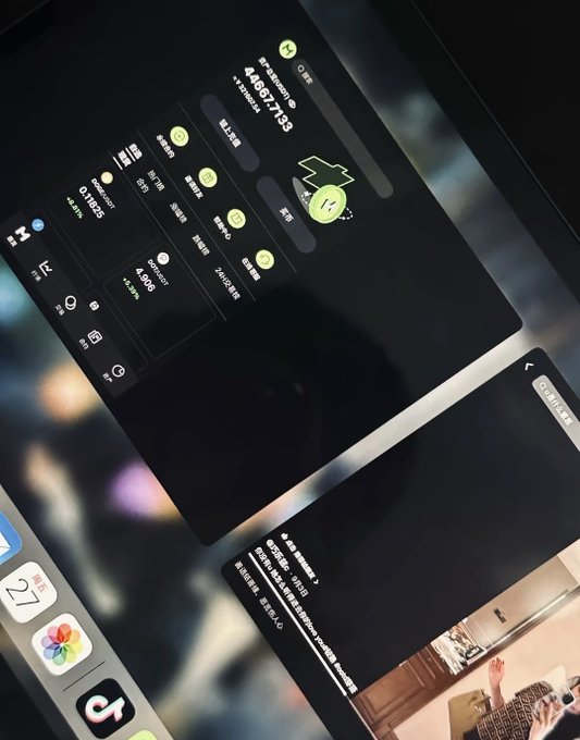 A blurry, angled photograph of two smartphone screens displaying a dark-themed app interface with Chinese text, numerical values including '4,057,713' and '0.1983', and a calendar interface at the bottom.