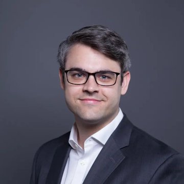 Bitwise CEO Hunter Horsley is pictured here in a professional headshot, smiling at the camera in a dark suit jacket and glasses. The image accompanies his commentary on making crypto adoption easier by removing the technical complexity that deters busy investors from engaging with wallets, custody, and multiple blockchains.
