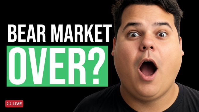 A YouTube creator announces a live stream with a shocked facial expression, featuring a thumbnail that reads "BEAR MARKET OVER?" alongside a red "LIVE" badge, teasing a discussion on a potential market reversal and trading opportunities.