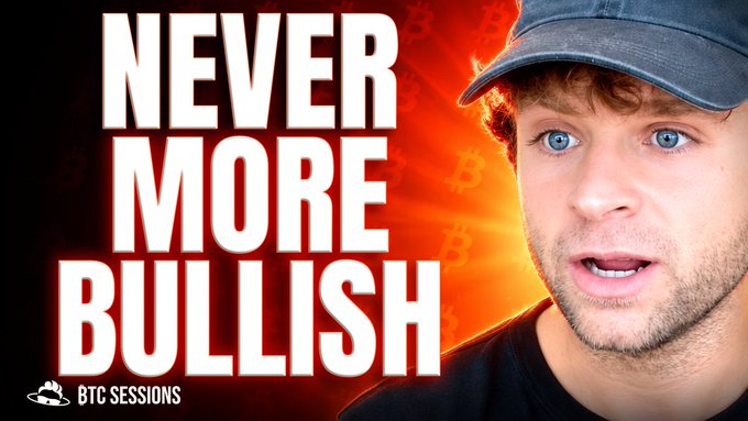 A YouTube thumbnail featuring a young man with blue eyes and a cap against an orange Bitcoin-themed background with bold text reading 'NEVER MORE BULLISH' and a 'BTC SESSIONS' logo.