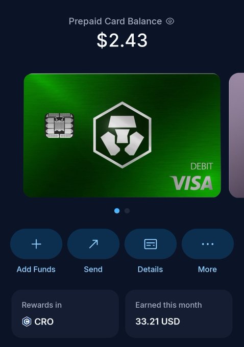 A digital wallet interface showing a Prepaid Card Balance of $2.43 with a green Crypto.com Visa debit card, and 33.21 USD earned this month in CRO rewards.
