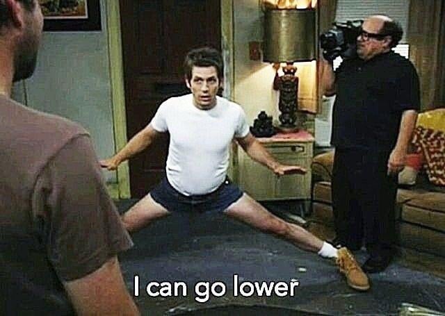 iced coffee on a table, with "I can go lower" written above it, and two men in the background.