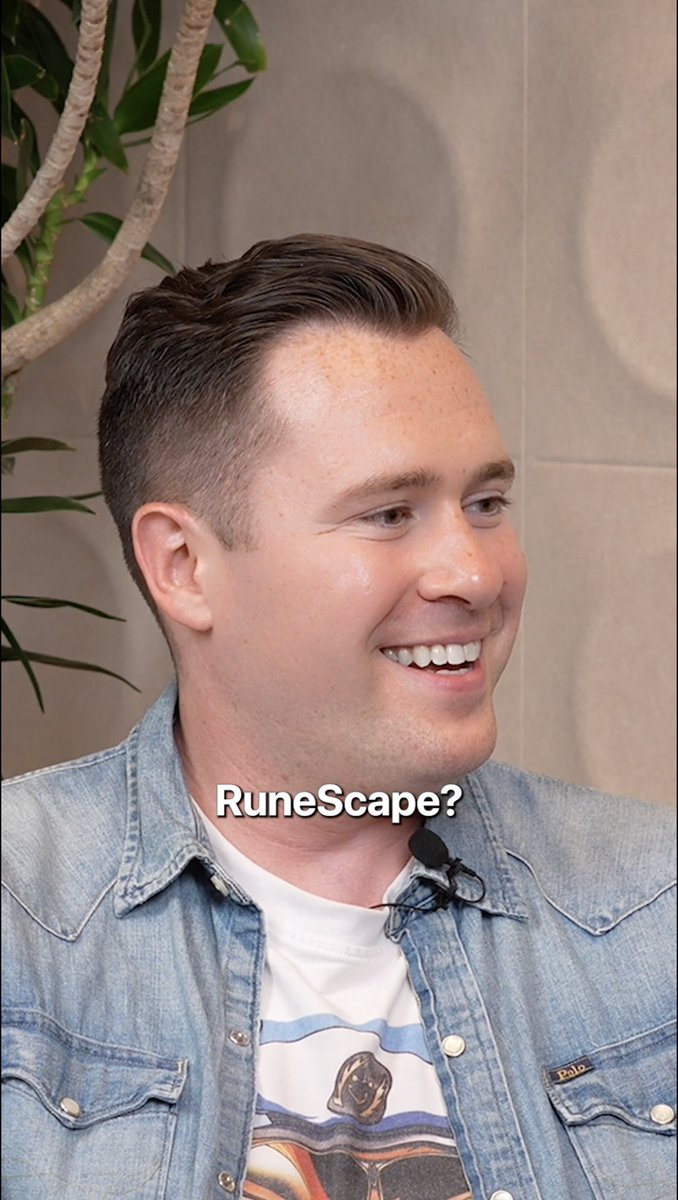 The image features a man wearing a denim jacket, smiling at the camera while sitting down. The caption of the image includes some text that reads "Digital markets that never close. From gaming economies to 24/7 markets, the behavior was always there. The infrastructure just caught up." This suggests that the man is talking about the evolution and growth of digital markets over time.
