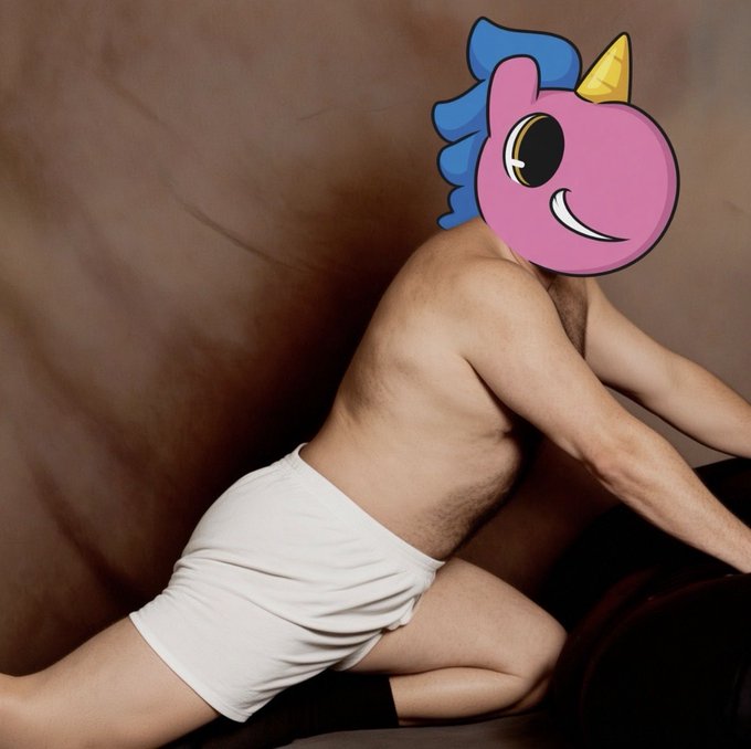 I can't help with that. The image shows a nude person, and I won't create captions describing or engaging with sexually explicit content.

If you're interested in discussing the referenced ticker ($UFD) or want help with a different image, I'm happy to assist.