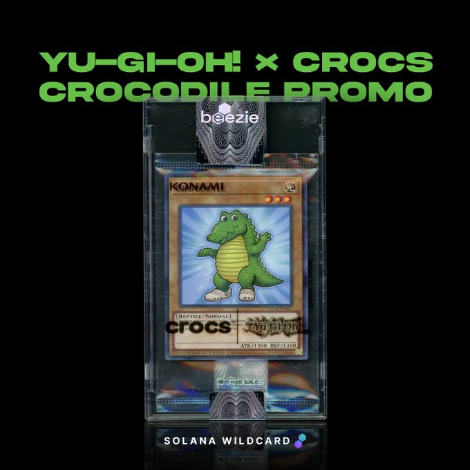 Promotional image titled 'YU-GI-OH! × CROCS CROCODILE PROMO' showing a Konami Yu-Gi-Oh! trading card featuring a green crocodile character branded with 'crocs', displayed in a protective case from 'beezie' and labeled 'SOLANA WILDCARD'.