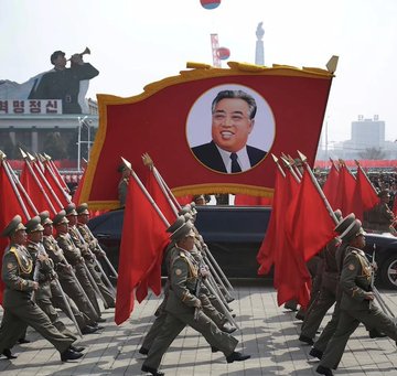 This image depicts a North Korean military parade, reflecting the nation implicated in a recent $7.7 million Bitcoin heist by the Lazarus group, according to Arkham Intelligence.