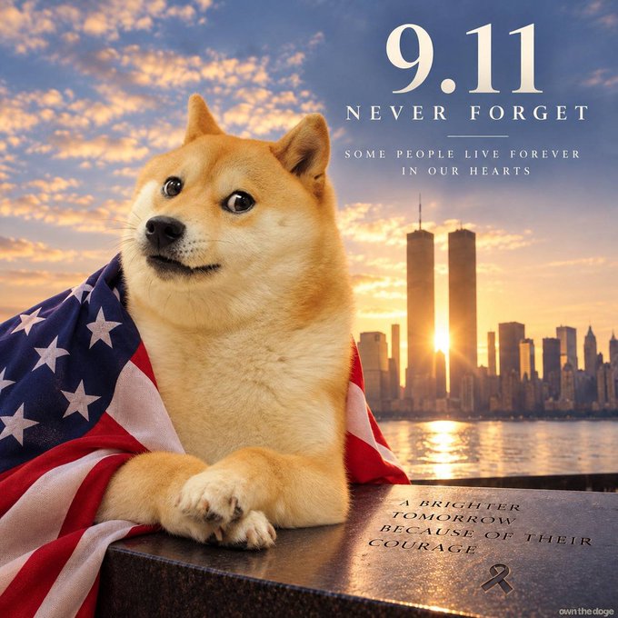 A Shiba Inu dog draped in an American flag sits before a sunset view of the New York City skyline featuring the Twin Towers, with text reading "9.11 NEVER FORGET - SOME PEOPLE LIVE FOREVER IN OUR HEARTS" and "A BRIGHTER TOMORROW BECAUSE OF THEIR COURAGE" engraved on the memorial stone.