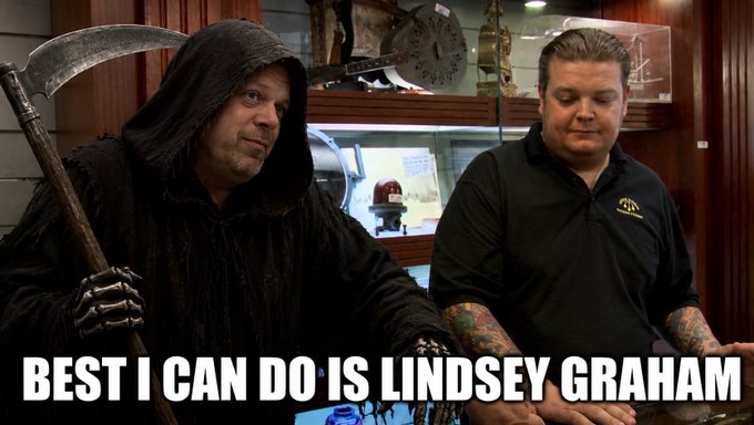 A scene from a show featuring a man in a grim reaper costume holding a scythe next to another man in a black shirt, with the text 'BEST I CAN DO IS LINDSEY GRAHAM' at the bottom.