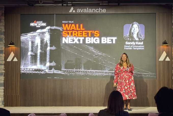 Sandy Kaul, Head of Innovation at Franklin Templeton, delivers a solo talk titled "Wall Street's Next Big Bet" at an Avalanche (avax) event in New York, with her presentation displayed on a large screen behind her on stage.