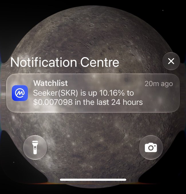 iPhone Notification Centre over a moon background, displaying a Watchlist alert: 'Seeker(SKR) is up 10.16% to $0.007098 in the last 24 hours' from 20m ago.