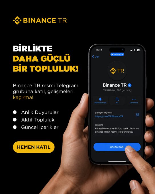 The image shows a person holding up their phone, which displays an advertisement for Binance TR. The text on the phone reads "Binance TR" along with some other information about joining the Telegram group or following the community updates. This suggests that the person is interested in staying informed and engaged with the latest developments within the Binance TR community.
