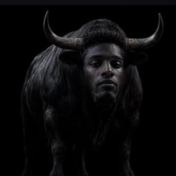 A surreal, dark portrait of a figure with a bull's head and horns merged with a human face emerging from black shadows.