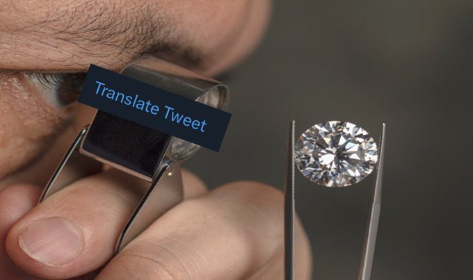 The image shows a person holding a pair of tweezers over a diamond, with a magnifying glass above them. There are also some text elements in the image that read "Translate Tweets" and "$XRP". The focus on these details suggests that there might be an advertisement or promotional post related to diamonds or a social media campaign involving diamonds.
