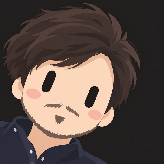 A cartoon-style avatar or illustration of a young man with messy brown hair, a slight beard, rosy cheeks, and simple black oval eyes, wearing a dark blue shirt.