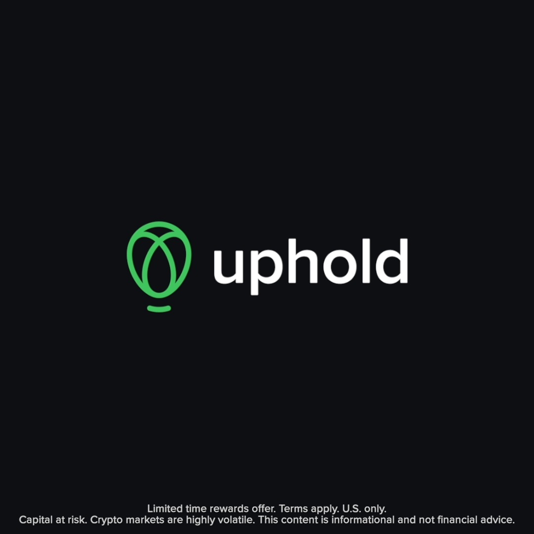 The image displays the Uphold logo, featuring a green hot air balloon icon next to the word "uphold" in white lowercase letters on a black background, with a disclaimer at the bottom stating "Limited time rewards offer. Terms apply. U.S. only. Capital at risk. Crypto markets are highly volatile. This content is informational and not financial advice." The logo serves as branding for the post promoting Uphold's Direct Deposit and Auto-Invest features, which allow users to convert paychecks into up to 10 cryptocurrencies and earn 3% back in XRP.