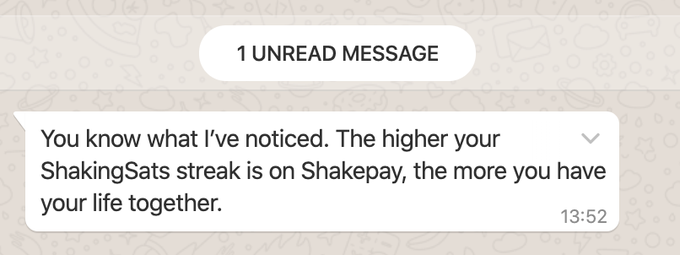 A Shakepay messaging app notification displays "1 UNREAD MESSAGE" with the text: "You know what I've noticed. The higher your ShakingSats streak on Shakepay, the more you have your life together," sent at 13:52. The image ties into the accompanying post by reinforcing how daily ShakingSats actions represent small, consistent rituals toward building a more put-together future.