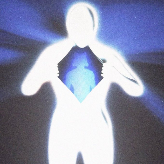 A glowing white humanoid figure holding a blue diamond-shaped gem against a dark, cloudy background, resembling the Man of Steel from DC Comics.