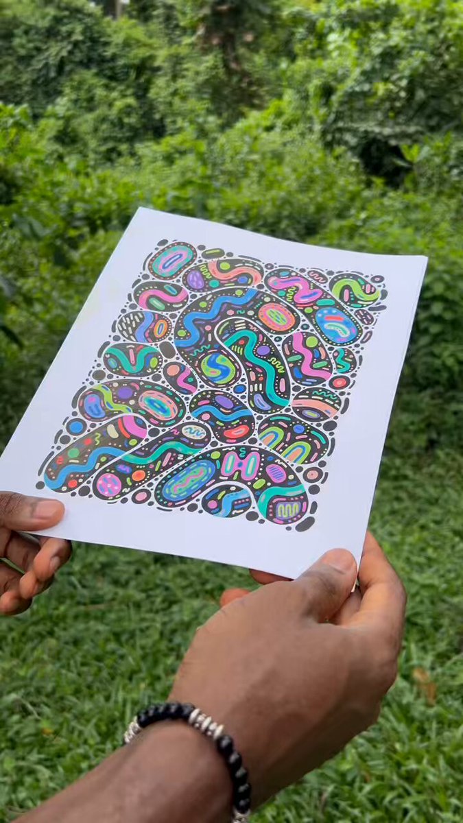 The image shows a person holding up a piece of paper with an abstract drawing or painting on it, which appears colorful and visually appealing. The text "gm" can be seen at the bottom left corner of the image, possibly indicating that this is part of a series or collection of images related to the same theme.