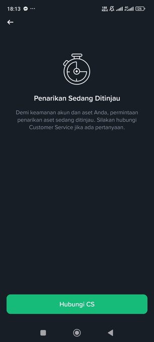 A dark mobile app screen showing a stopwatch icon with the Indonesian text 'Penarikan Sedang Ditinjau' (Withdrawal Under Review), informing users that their withdrawal request is being processed for security reasons, with a green 'Hubungi CS' (Contact CS) button at the bottom.