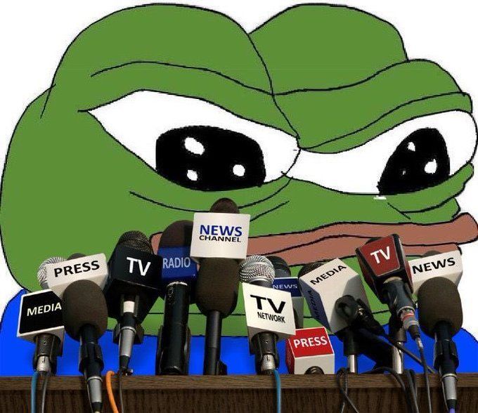 A cartoon illustration of the Pepe the Frog character with a serious expression, sitting behind a podium filled with microphones labeled with words like 'PRESS', 'TV', 'RADIO', 'MEDIA', and 'NEWS'.