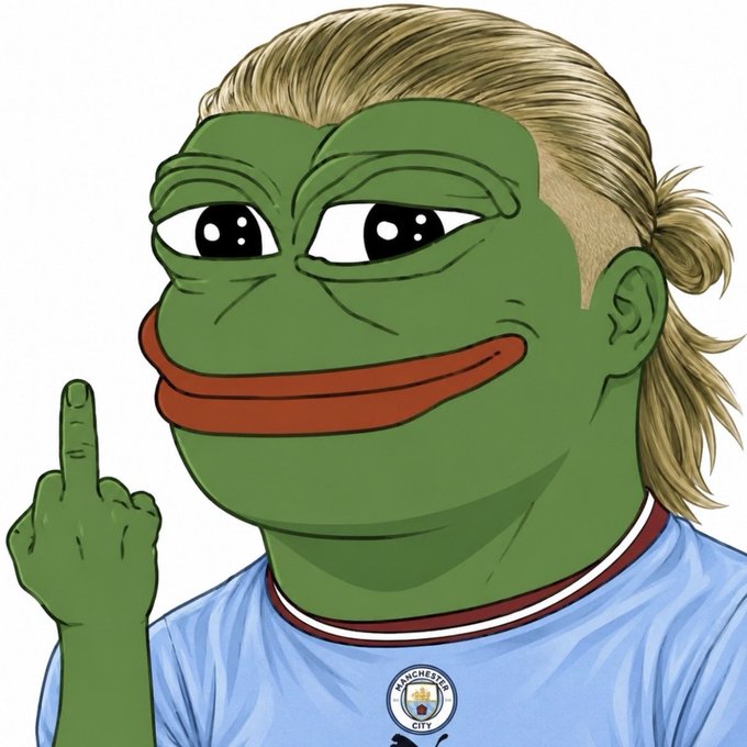 A Pepe the Frog meme character with blonde hair wearing a Manchester City football jersey, raising a finger.