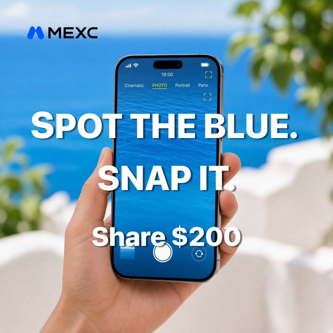 A hand holds a smartphone with its camera app open, capturing a vivid blue seascape framed by greenery and white stone, overlaid with bold white text reading "SPOT THE BLUE. SNAP IT. Share $200" and the MEXC logo. The image promotes a World Photography Day contest encouraging users to photograph the signature "MEXC blue" in everyday scenes for a chance to win a share of $200.
