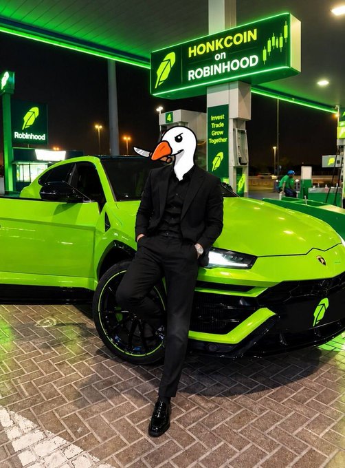 Person in a black suit with a cartoon goose head standing in front of a green Lamborghini Urus at a Robinhood gas station, with a sign reading 'HONKCOIN on ROBINHOOD'.