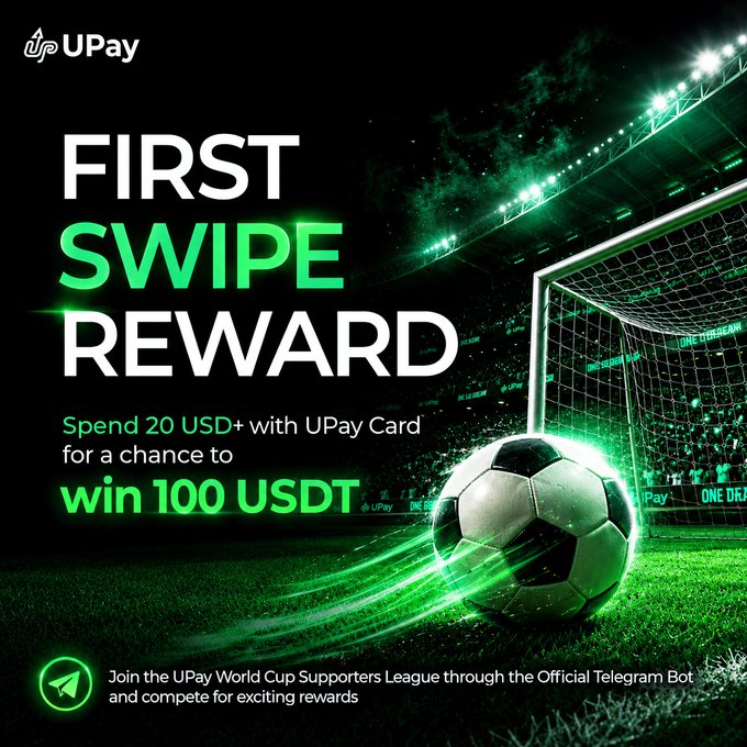 The image features a soccer ball, which appears to be kicked by a player. The background of the image is dark green, giving an impression that the photo was taken at night or during low light conditions. There are also some text elements present in the image, including "First swipe reward", " Spend 20 USD+ with UPay Card during the campaign period count".