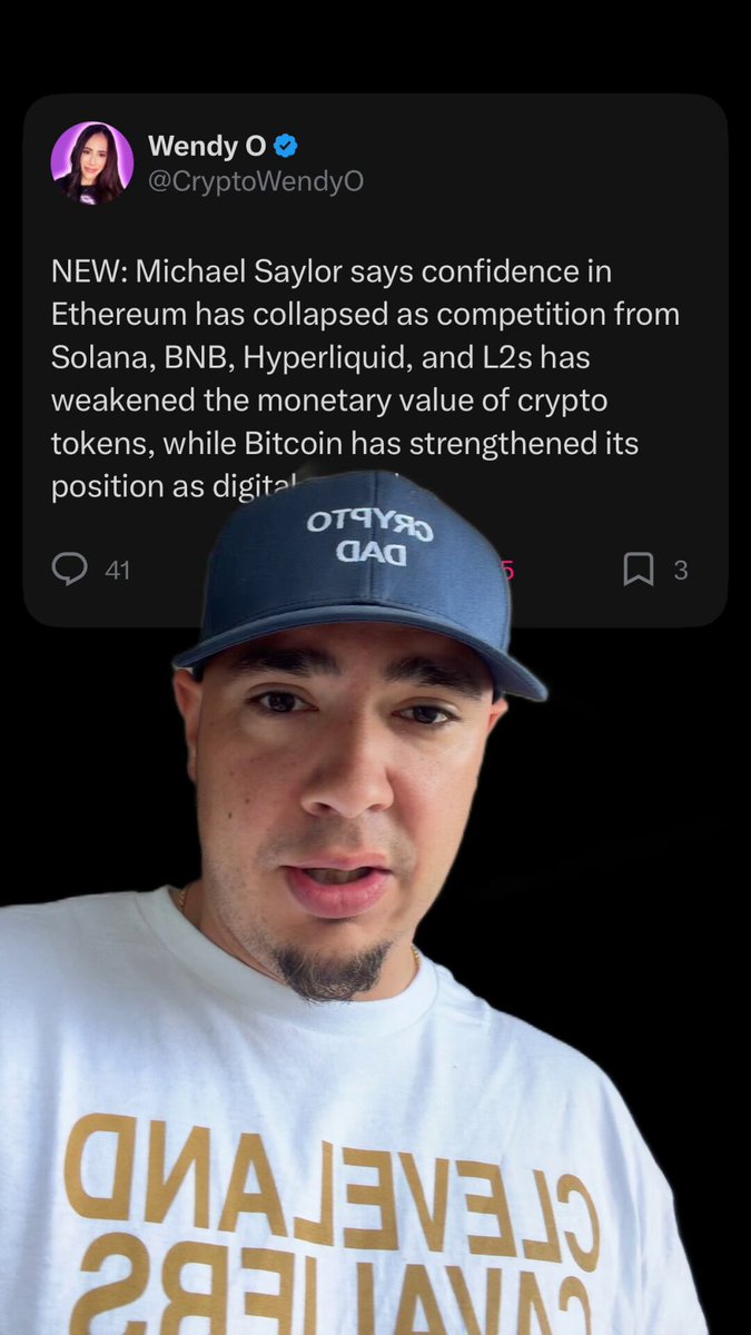 The image features a man wearing a blue baseball cap and a white t-shirt that says "Focus on what is in the image and how it relates to the post." The caption below his photo reads, "Bitcoin doesn't have any competition inside the crypto market. Gold is BTC's competition here.". This caption highlights the comparison between Bitcoin and gold as competing assets within the cryptocurrency market.
